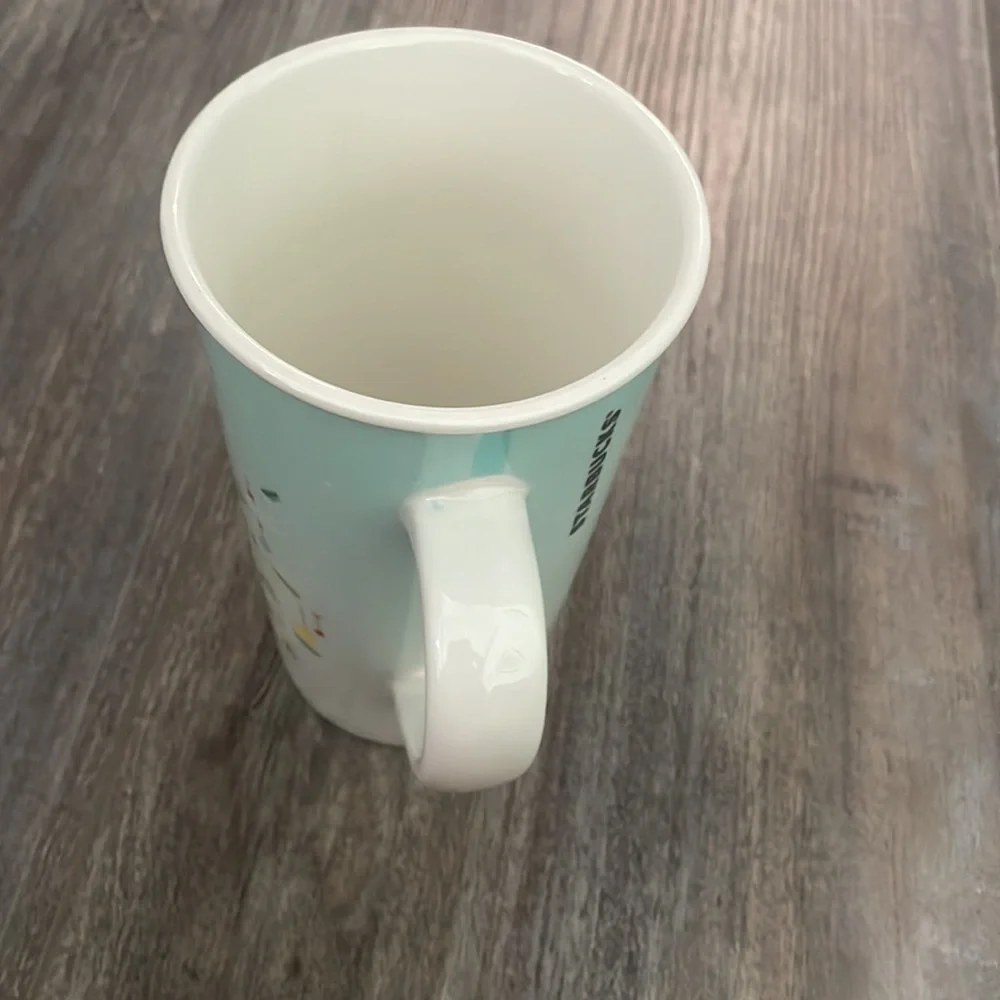 Starbucks Coffee Mug 2019, Tall 16 Oz. Christmas Tree on Light Blue Background.